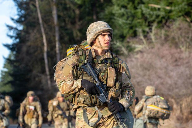 A cadet rucks with his team during the 8th Brigade Army ROTC Ranger Challenge.