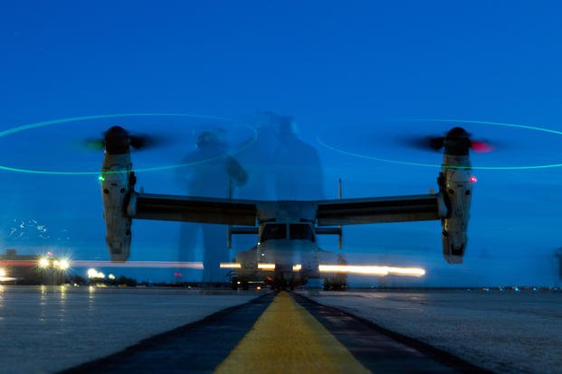 Marines work together to ensure the safe takeoff of a MV-22B Osprey at Peterson AFB