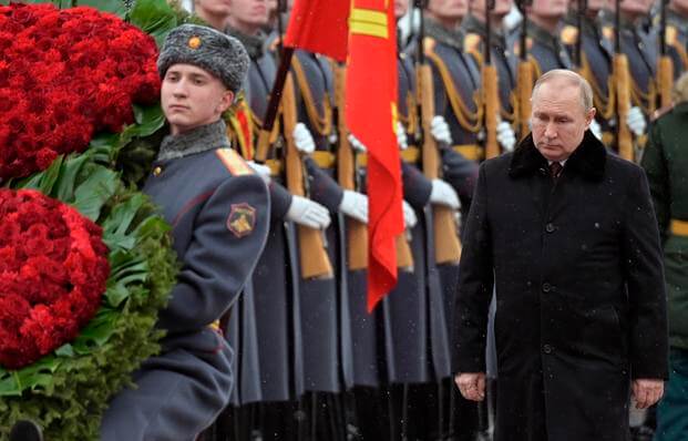 Putin attends a wreath-laying ceremony at the Tomb of the Unknown Soldier.
