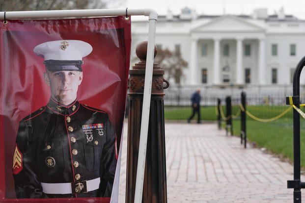 A poster photo of U.S. Marine Corps veteran and Russian prisoner Trevor Reed