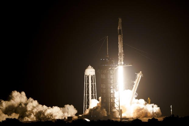 A SpaceX Falcon 9 rocket lifts off from the Kennedy Space Center.