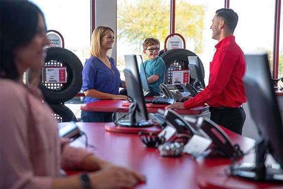 Discount Tire showroom. People checking out at cash register