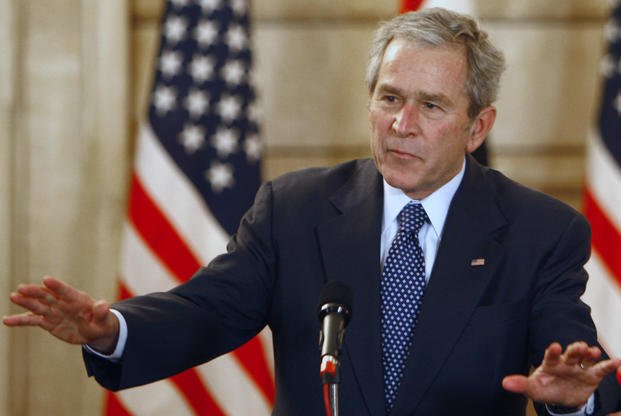 President George W. Bush reacts after shoes were thrown at him in Iraq.