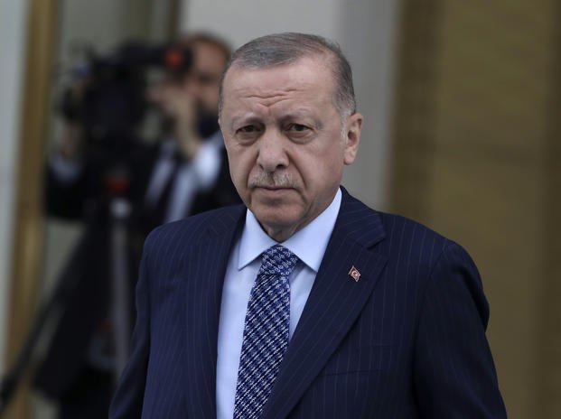 Turkish President Recep Tayyip Erdogan arrives for a ceremony 
