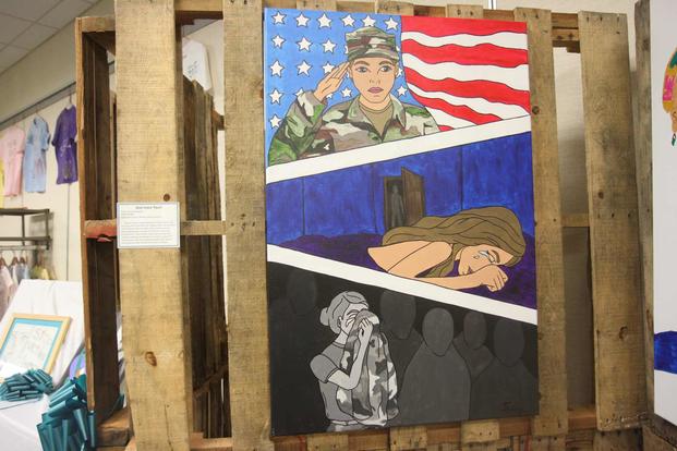 A painting depicts the devastation caused by sexual assault amongst service members.