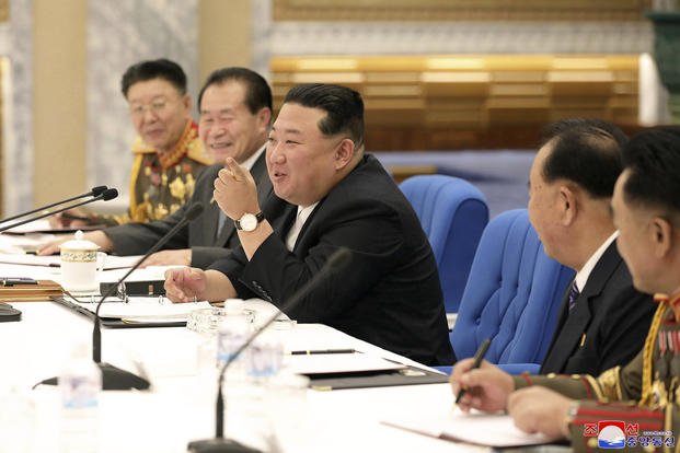 North Korean leader Kim Jong Un, center, attending a meeting with his senior military officials