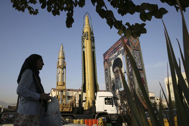 A Ghadr-H, a solid-fuel surface-to-surface Sejjil missile, stands in Iran. 