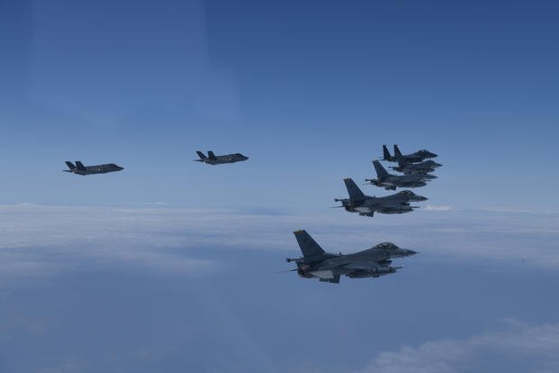 U.S. and South Korea Air Force fighter jets fly in formation during a joint drill