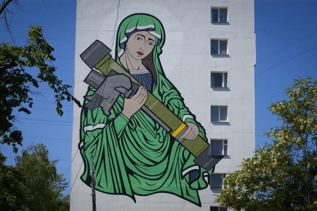mural depicts an image known as "Saint Javelina"- Virgin Mary cradling a US-made FGM-148 anti-tank weapon Javelin
