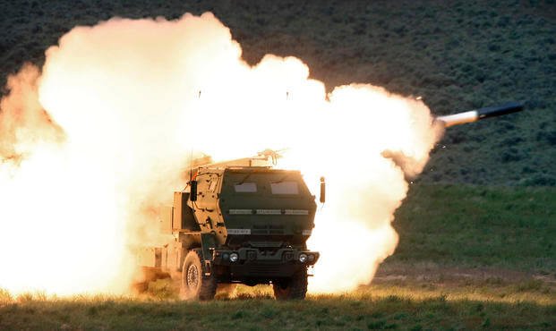 launch truck fires the High Mobility Artillery Rocket System (HIMARS) produced by Lockheed Martin