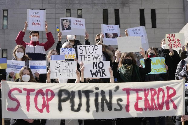 People protest at a rally calling for Russia to stop the war against Ukraine in Seoul, South Korea