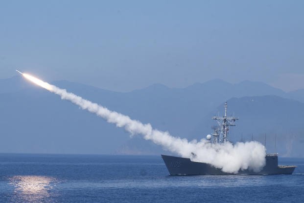A Taiwanese Cheng Kung class frigate fires an anti air missile.