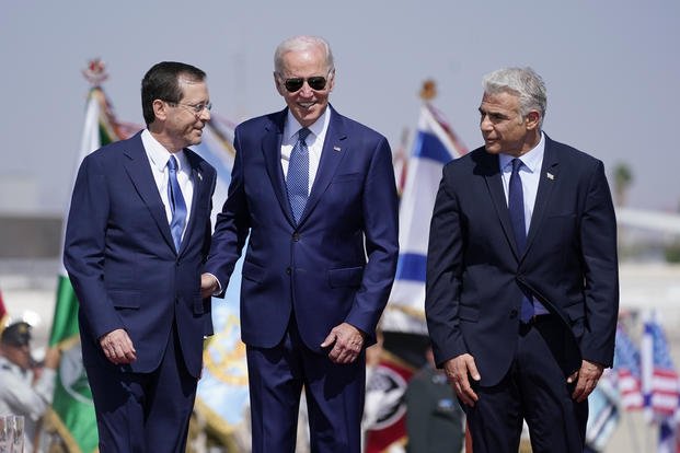 President Joe Biden stands with Israeli Prime Minister Yair Lapid, right, and President Isaac Herzog