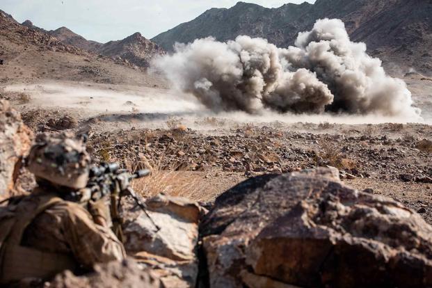 Marine watches effects of an anti-personnel obstacle breaching system.