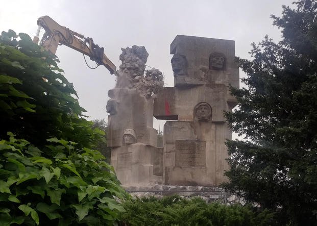 Workers begin to demolish a Soviet-era monument to the Red Army, in Brzeg, Poland