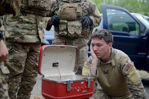 Staff Sgt. David Dezwaan, 60th Civil Engineer Squadron explosive ordnance disposal technician, inspects the wiring of a simulated radioactive dispersal device during an exercise May 5, 2016, at Clear Lake, California. (Senior Airman Bobby Cummings/U.S. Air Force photo)