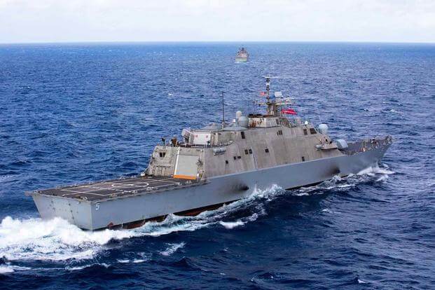 The Freedom-variant littoral combat ship USS Milwaukee steams through the ocean.
