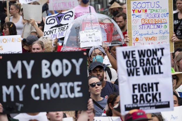 People protest the Supreme Court's decision to overturn Roe v. Wade. 
