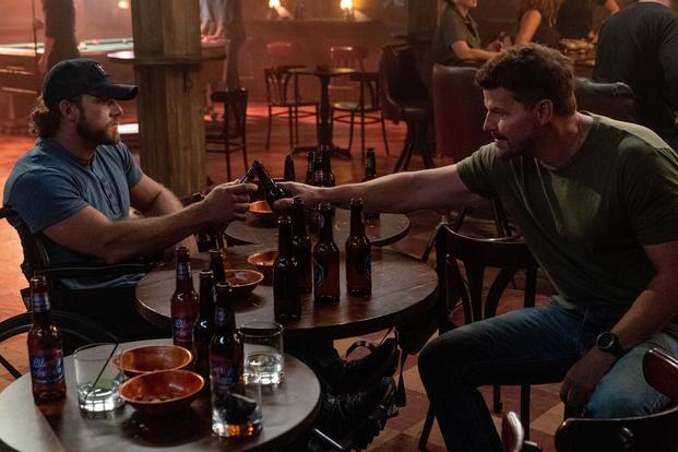 Clay Spenser (Max Thieriot) and Jason Hayes (David Boreanaz) share a beer on "SEAL Team." (Photo: Monty Brinton/Paramount+) SEAL Team Max Thieriot David Boreanaz