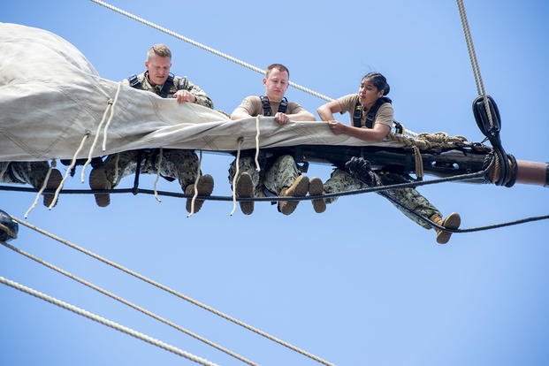 U.S. Navy petty officers first class, selected for promotion to chief petty officer, participate in a climbing evolution during Chief Petty Officer Heritage Weeks in Boston.
