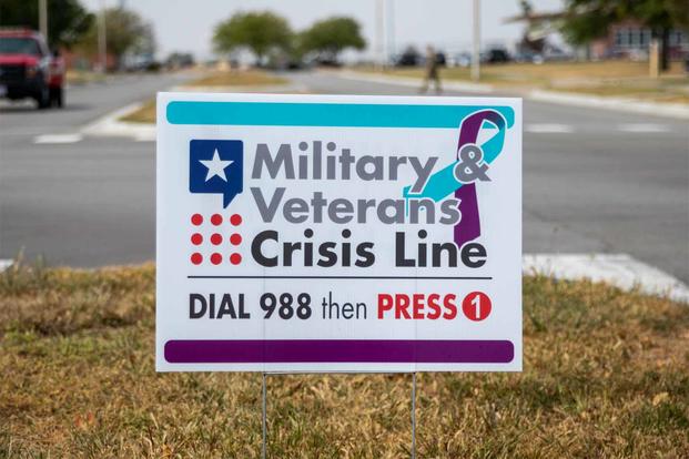 A sign for the Military and Veterans Crisis Line.