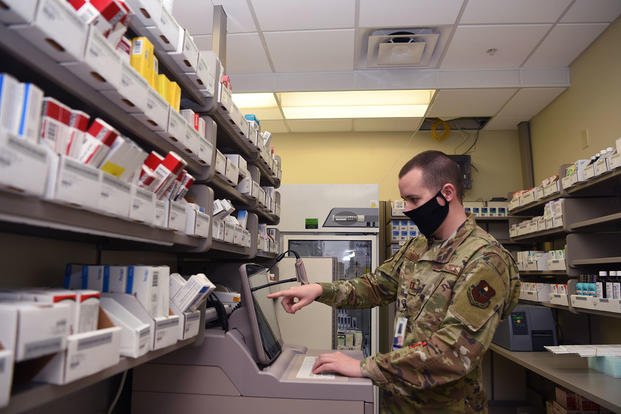 U.S. Air Force Capt. Adam Remme, 17th Medical Group pharmacy element chief, mandates prescription refills during the preparations for the Ross Clinic pharmacy’s curbside reinstatement on Goodfellow Air Force Base, Texas.