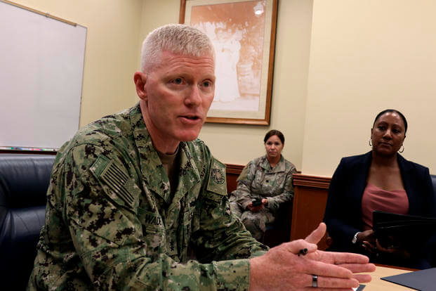 Navy Rear Adm. John Wade, commander of Joint Task Force Red Hill, speaks to reporters