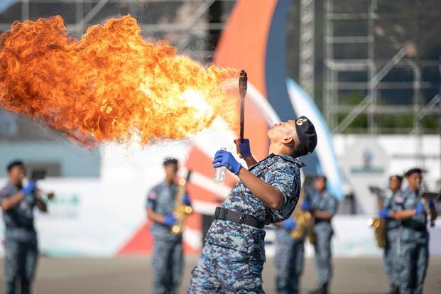 A service member from the Republic of Korea spits fire.