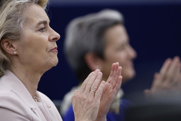 European Commission President Ursula von der Leyen applauds during a ceremony