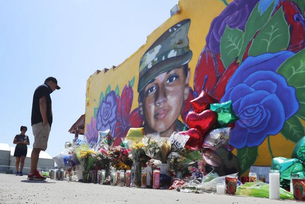People look at a mural of slain Army Spc. Vanessa Guillen.