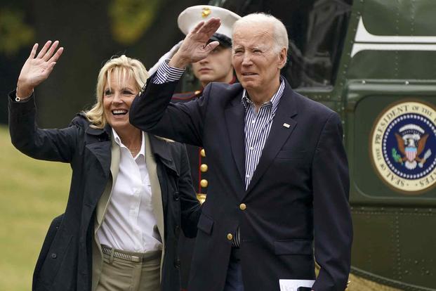 President Joe Biden and first lady Dr. Jill Biden wave.