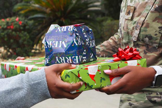 A soldier gives a gift