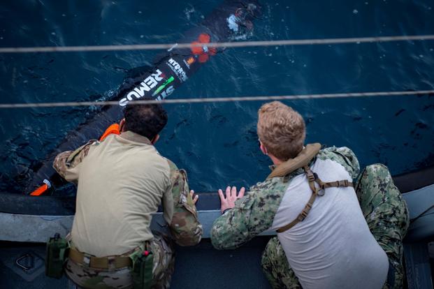 Sailors conduct launch and recovery training with an Unmanned Underwater Vehicle.