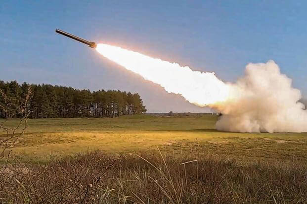 Two Reduced-Range Practice Rockets (RRPR) fire from an M142 High Mobility Artillery Rocket System.