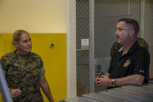 Donald Baldwin, the Marine Corps Base Camp Blaz chief of staff, right, briefs Sgt. Maj. Joy Maria Kitashima, the Marine Corps Installations Pacific sergeant major, during a visit to Andersen Air Force Base, Guam, May 18, 2021. (U.S. Marine Corps photo by Cpl. Andrew King) Donald Baldwin briefs Sgt. Maj. Joy Maria Kitashima.