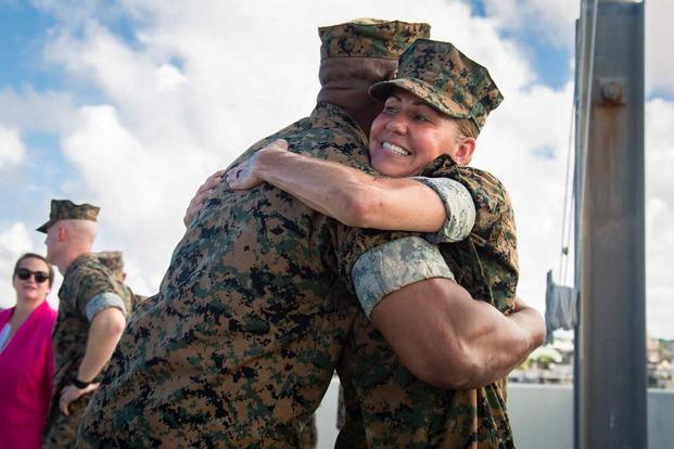 U.S. Marine Corps Col. Henry Dolberry Jr. congratulates Sgt. Maj. Joy Maria Kitashima during an award ceremony at the Marine Corps Installations Pacific headquarters building on Okinawa’s Camp Foster, June 23, 2022. Kitashima was awarded the Legion of Merit for her performance and accomplishments while serving as the sergeant major of MCIPAC. (U.S. Marine Corps photo by Sgt. Kayla V. Staten.) Col. Henry Dolberry Jr. congratulates Sgt. Maj. Joy Maria Kitashima.