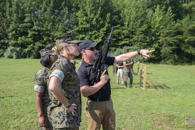 Sgt. Maj. Joy Kitashima, then Marine Corps Installations Pacific sergeant major, listens to instruction during a live-fire range at Weapons Training Battalion, Marine Corps Base Quantico, Virginia, Aug. 12, 2021.. (US Marine Corps photo by Sgt. Victoria Ross) Sgt. Maj. Joy Kitashima.