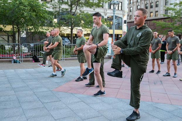 U.S. Marines assigned to Special Purpose Marine Air Ground Task Force Detroit demonstrate warm-up exercises.