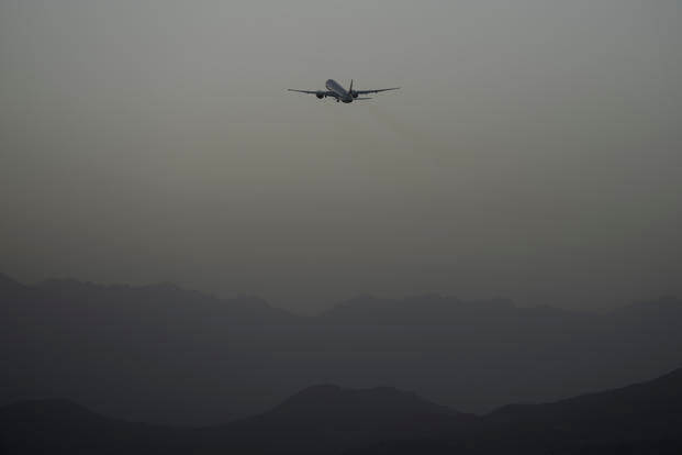A Qatar Airways aircraft takes off with foreigners from the airport in Kabul, Afghanistan.