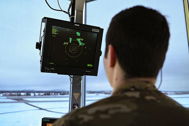 U.S. Air Force Senior Airman Andrew Huynh monitors a screen to locate aircraft on Fairchild Air Force Base, Washington.