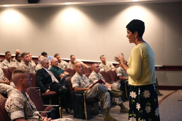 A deputy equal employment opportunity officer briefs officers and staff non-commissioned officers aboard Camp Johnson, N.C.