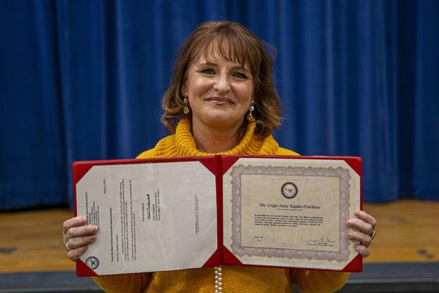 School Principal Leigh Anne Faulkner poses with her certificate after receiving the 2021 Department of Defense Education Activity Principal of the Year award for the Americas region at Tarawa Terrace Elementary School on Camp Lejeune.