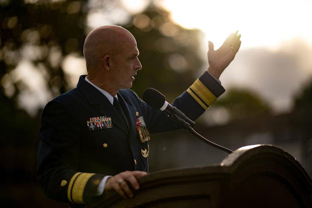 Rear Adm. William G. Kelly speaks to an audience during the annual Homecoming Medallion Ceremony