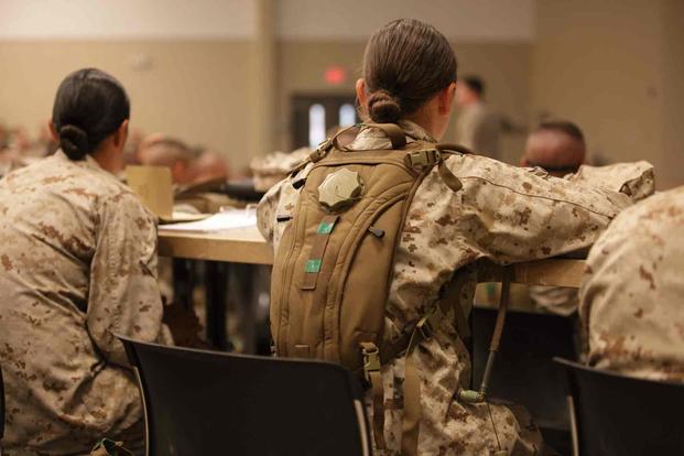 U.S. Marines watch their Combat Instructor teach.