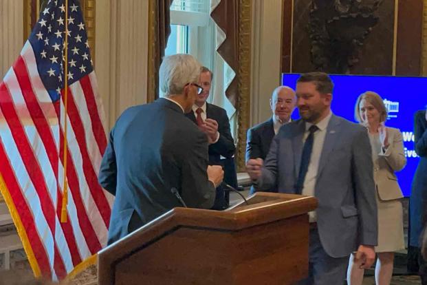 #AfghanEvac coalition president Shawn VanDiver fist bumps Denis McDonough.