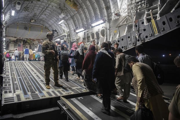 Afghan passengers board a U.S. Air Force C-17 Globemaster III.