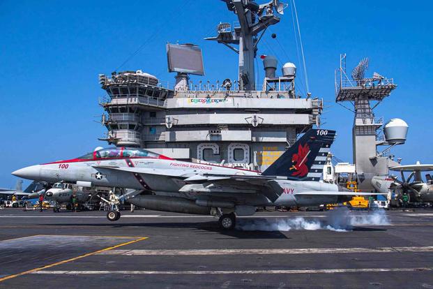 Super Hornet lands on USS Nimitz.