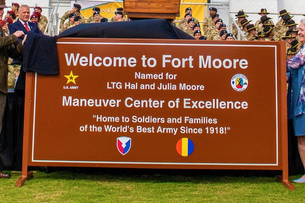 Fort Moore leaders unveil an official Fort Moore sign during a redesignation ceremony