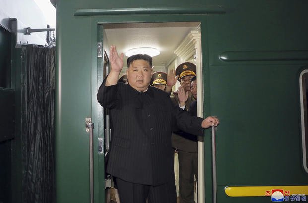 North Korea leader Kim Jong Un waving from a train in Pyongyang, North Korea