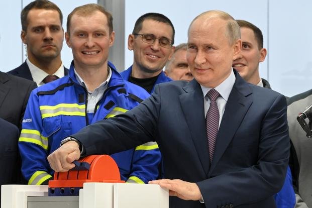  Russian President Vladimir Putin, foreground right, attends a launch ceremony